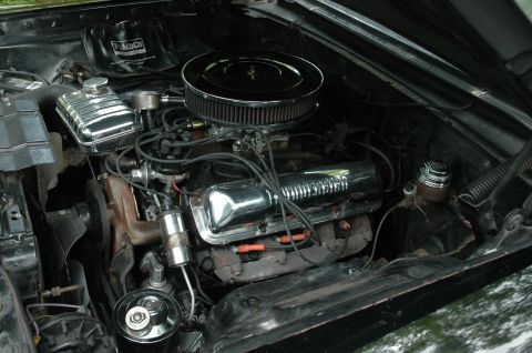 1964 Ford Galaxie - Engine bay of a 1964 Ford Galaxie, showing the V8 engine with chrome accents.