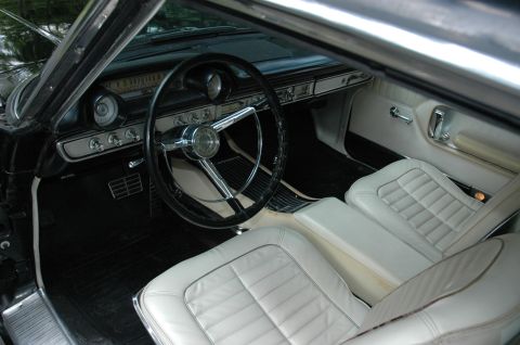 1964 Ford Galaxie - Interior view of a 1964 Ford Galaxie, showing the dashboard and front seats.