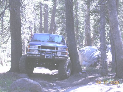 1994 Ford Bronco - A blue SUV navigates a rocky trail in a forest on August 27, 2005.