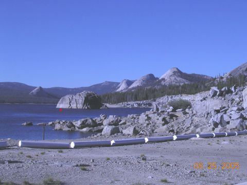1994 Ford Bronco - Scenic view of a lake and mountains, with a pipeline running along the shore. Date stamp: 08.25.2005.