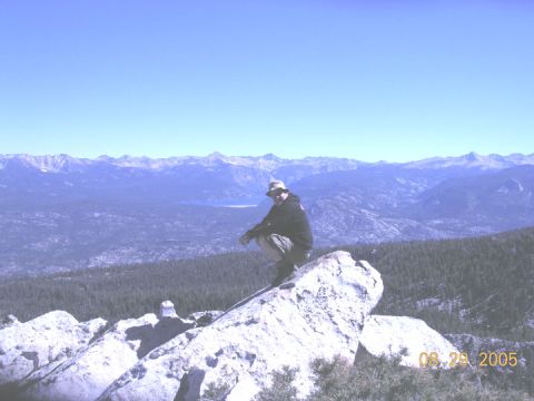 1994 Ford Bronco - A person surveys a vast mountain landscape from a rocky perch, with a date stamp indicating August 29, 2005.