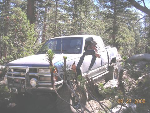 1994 Ford Bronco - A pickup truck navigates a wooded, rocky terrain on August 27, 2005.