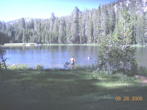 1994 Ford Bronco - A lake scene with two individuals enjoying a swim, with a date stamp indicating August 28, 2005.