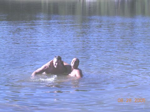 1994 Ford Bronco - Two men enjoy a swim in a lake on a sunny day, with a date stamp indicating August 28, 2005.