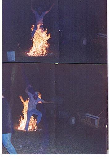 1966 Ford Ranchero - Two individuals leap over a large bonfire in this nighttime scene.