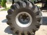 1990 Ford Bronco - Close-up of a large, tire and its metal rim, likely from a heavy-duty vehicle.