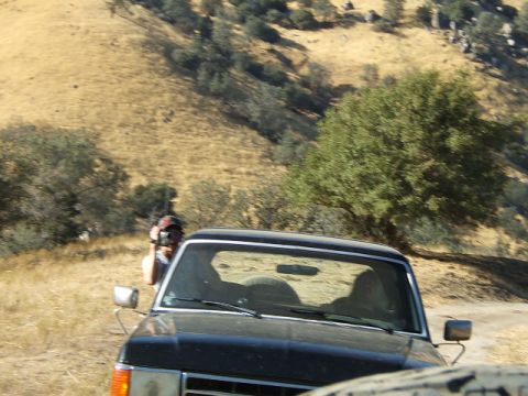 1988 Ford Bronco - Front view of a black Ford Bronco on a rural hillside.