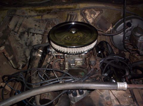 1973 Ford Ranchero - Close-up view of an engine bay, focusing on the carburetor and air filter.