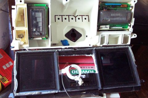 1985 Ford LTD Crown Victoria - Car dashboard instrument cluster with digital displays and gauges, including a 'MOTOR OIL 10W-30' label.