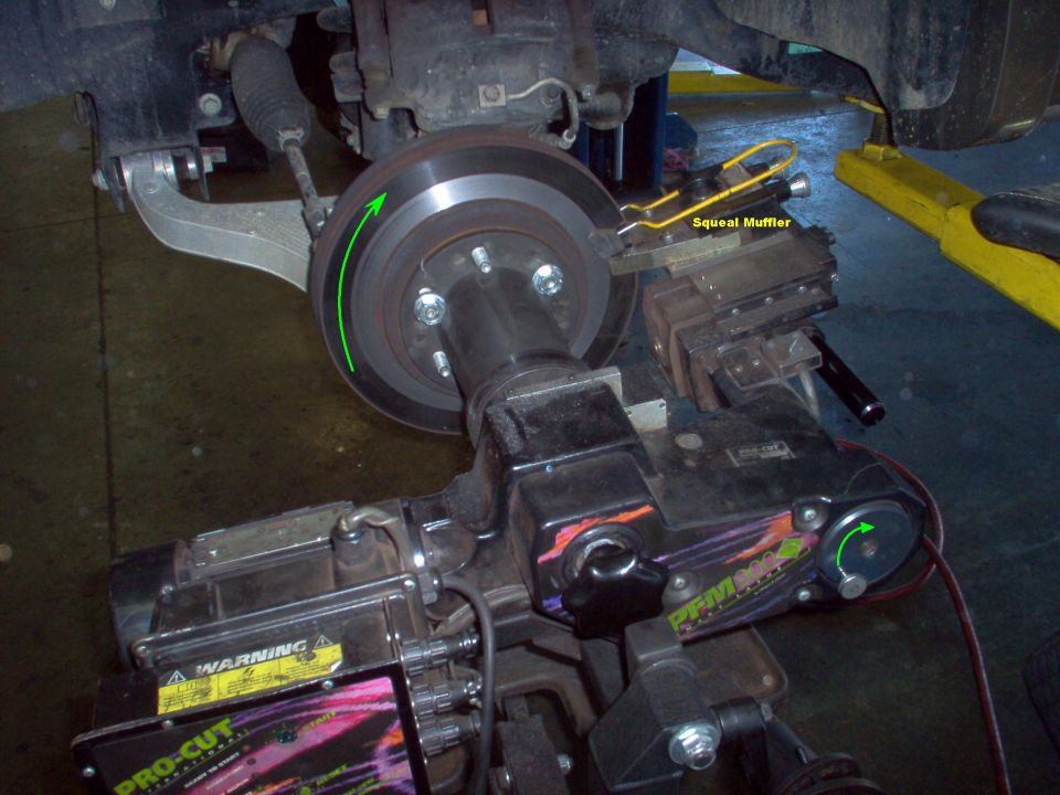 On-car brake lathe.  When the small knob on the radial control is pushed in, it is automatically driven to move the cutter base outward.