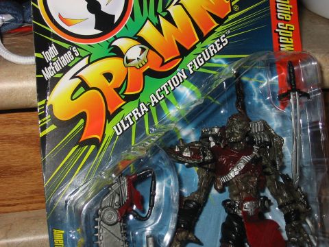 1991 Ford Bronco - Spawn action figure in packaging with accessories, including a sword and chainsaw.