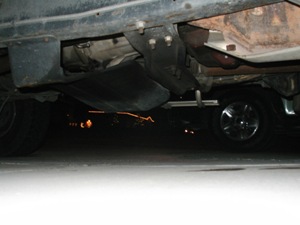 1989 Ford Bronco - Undercarriage view of a vehicle, focusing on the frame and suspension components.