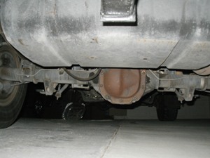 1989 Ford Bronco - Underside view shows the rear axle and fuel tank of a vehicle.