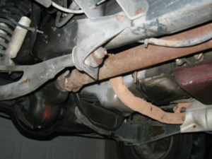 1989 Ford Bronco - Underside view of vehicle components, including suspension and exhaust pipes. Supermotors.net logo is present.