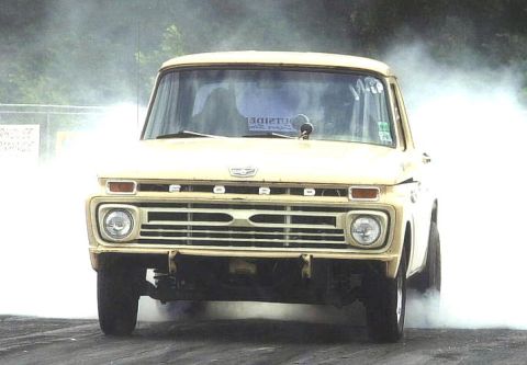 1972 Ford Ranchero - Ford F-Series truck performing a burnout, kicking up a large amount of smoke.