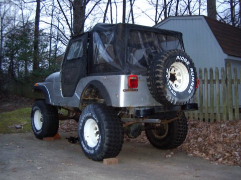 1978 Jeep CJ5 - This Jeep CJ5 is equipped with a soft top and a spare tire on the rear, ready for off-road adventures.