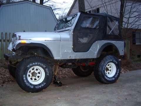 1978 Jeep CJ5 - This silver 1978 Jeep CJ5 is shown with a lifted suspension and large off-road tires.