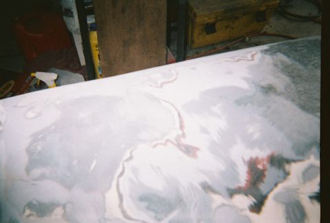 1972 Ford Ranchero - Bodywork on a vehicle part is being prepared for painting, with primer and filler visible.