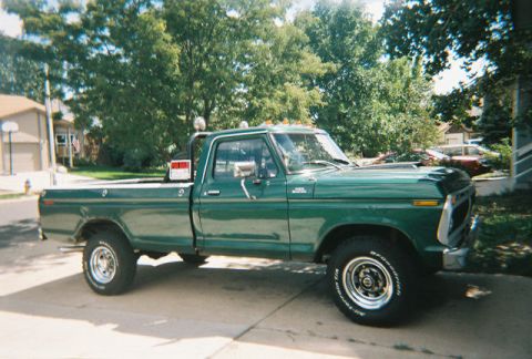 1972 Ford Ranchero - This green pickup truck, likely a 1973 Ford F-Series, is viewed from the front three-quarter angle.