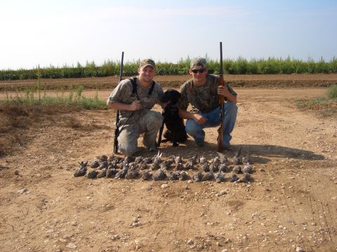 1990 Ford Bronco - Hunters and their dog pose with a large pile of birds after a hunt.