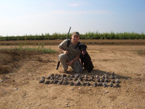 1990 Ford Bronco - A hunter poses with his dog and a large collection of birds after a hunt.