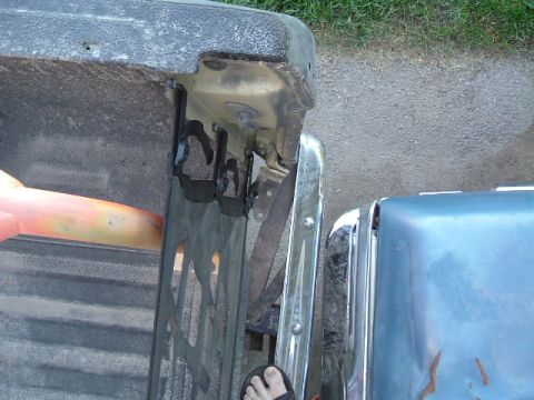 1979 Ford Bronco - The rear of a truck is shown, with a portion of another vehicle's fender visible to the right.