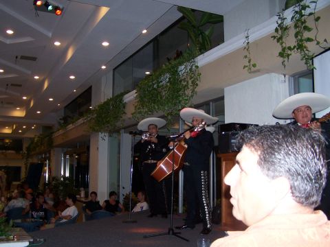 1979 Ford F-150 - A mariachi band performs for an audience in a restaurant or event space.