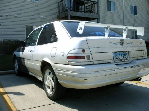 1992 Ford Probe - Rear view of a white 1992 Ford Probe modified with a large spoiler and decals.