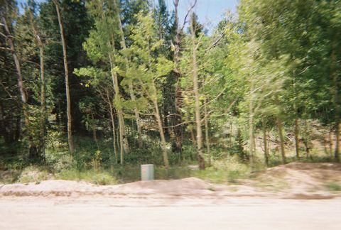 1972 Ford Ranchero - A utility box is visible in a natural setting surrounded by trees.