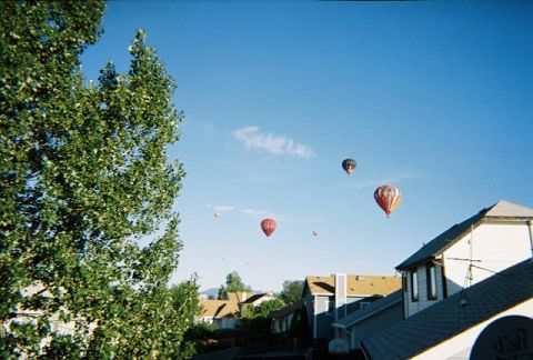 1972 Ford Ranchero - Hot air balloons drift over a suburban neighborhood on a clear day.