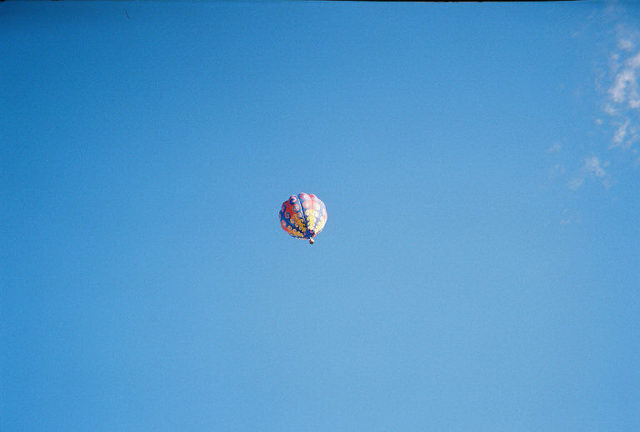 Colorful hot air balloon against a clear blue sky