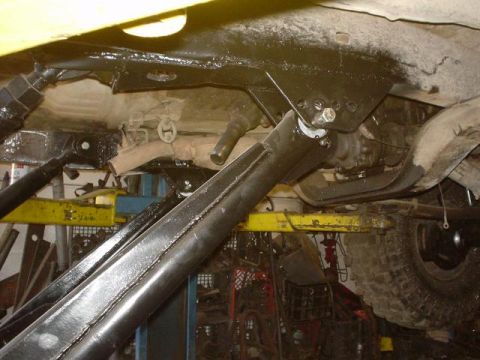 1991 Toyota Tacoma - Undercarriage view shows painted frame components and a tire, with visible text 'SUPERMOTORS.NET'.