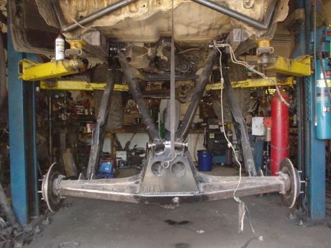 1991 Toyota Tacoma - Custom rear axle assembly being worked on in a garage, with suspension components visible.