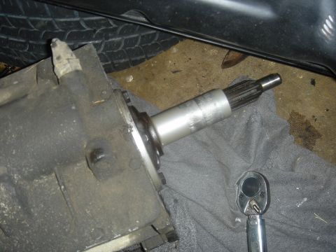 1986 Ford Mustang - A transmission part is shown with a ratchet nearby, resting on a gray cloth.