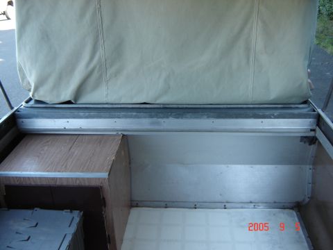 1993 Ford Bronco - Interior view of a pop-up tent trailer with a canvas cover extended.
