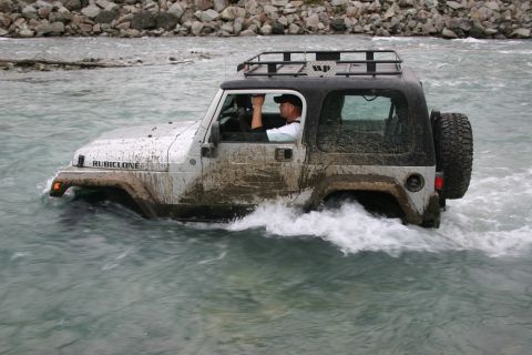 2003 Jeep TJ - Muddy 2003 Jeep TJ Rubicon fording a river with a roof rack.