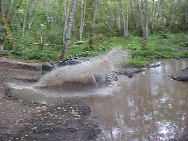 1992 Ford Ranger splashing through water off-road