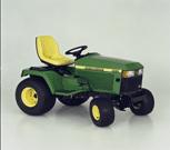 1990 Ford Bronco - A green John Deere riding lawn mower is shown from a three-quarter front perspective against a plain background.
