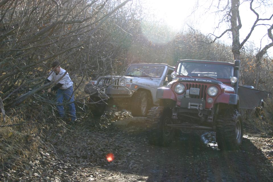 Red Jeep TJ front view with "ALASKAN EXTREME" on hood, 2003 Jeep TJ