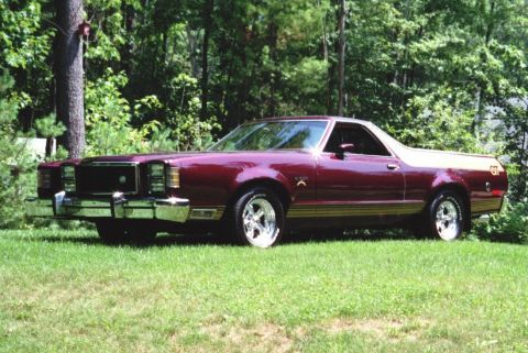1972 Ford Ranchero - This 1977 Ford Ranchero GT features a distinctive maroon paint job with gold side trim and a GT badge on the rear quarter panel.