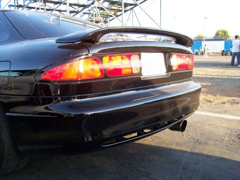1993 Ford Probe - Rear view of a black 1993 Ford Probe, showing its distinctive taillights and spoiler.