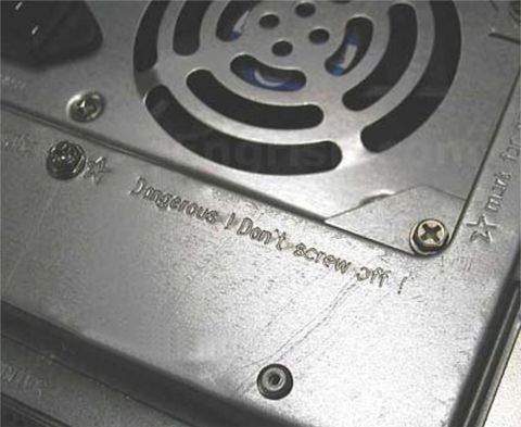 1993 Ford Bronco - This close-up shows a computer fan and casing with etched warning text, not a vehicle.