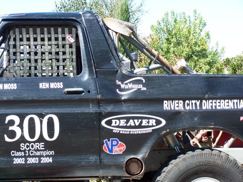 1979 Ford Bronco - This off-road race truck displays multiple sponsor decals and racing information.