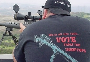 1993 Ford Bronco - Man aims a scoped rifle, wearing a t-shirt with a political message and a gun graphic.
