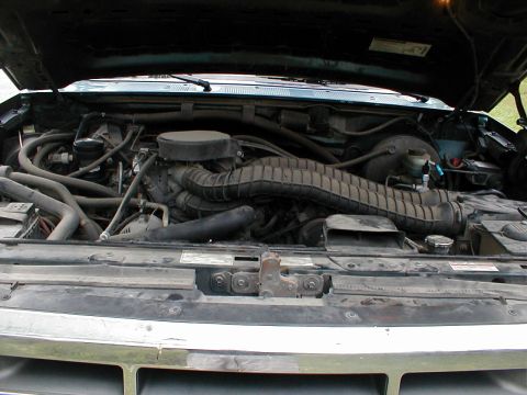 1994 Ford Bronco - Engine bay view of a 1994 Ford Bronco, showing the engine and associated components.