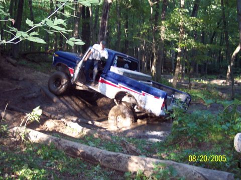 1977 Ford F-150 - This 1977 Ford F-150 is shown tackling a challenging muddy terrain during an off-road excursion.