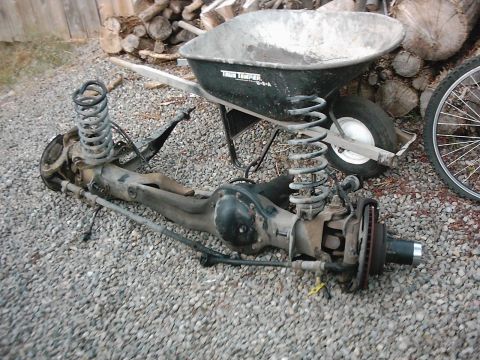 1978 Ford Bronco - Front axle assembly from a 1978 Ford Bronco, with springs and brake components visible.