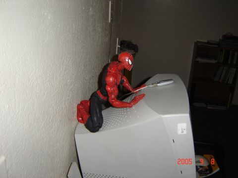 1993 Ford Bronco - Spiderman action figure on a computer monitor with a watermark for Supermotors.net.