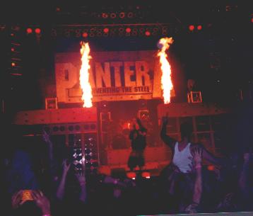 1993 Ford Bronco - A band performs on a stage with pyrotechnics and a large "PANTER" logo behind them.