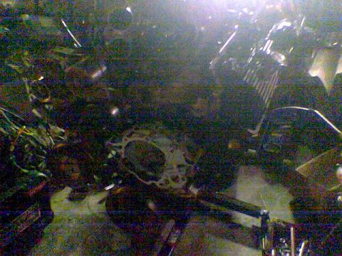 1988 Ford Bronco - Close-up view of engine components, including a gasket and wiring.